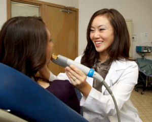 Dr. Choe examining Patient