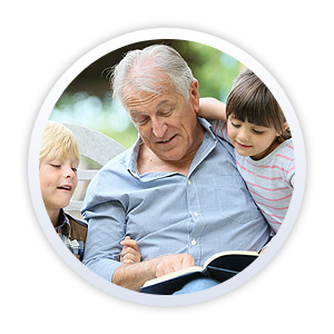 Older man reading to children